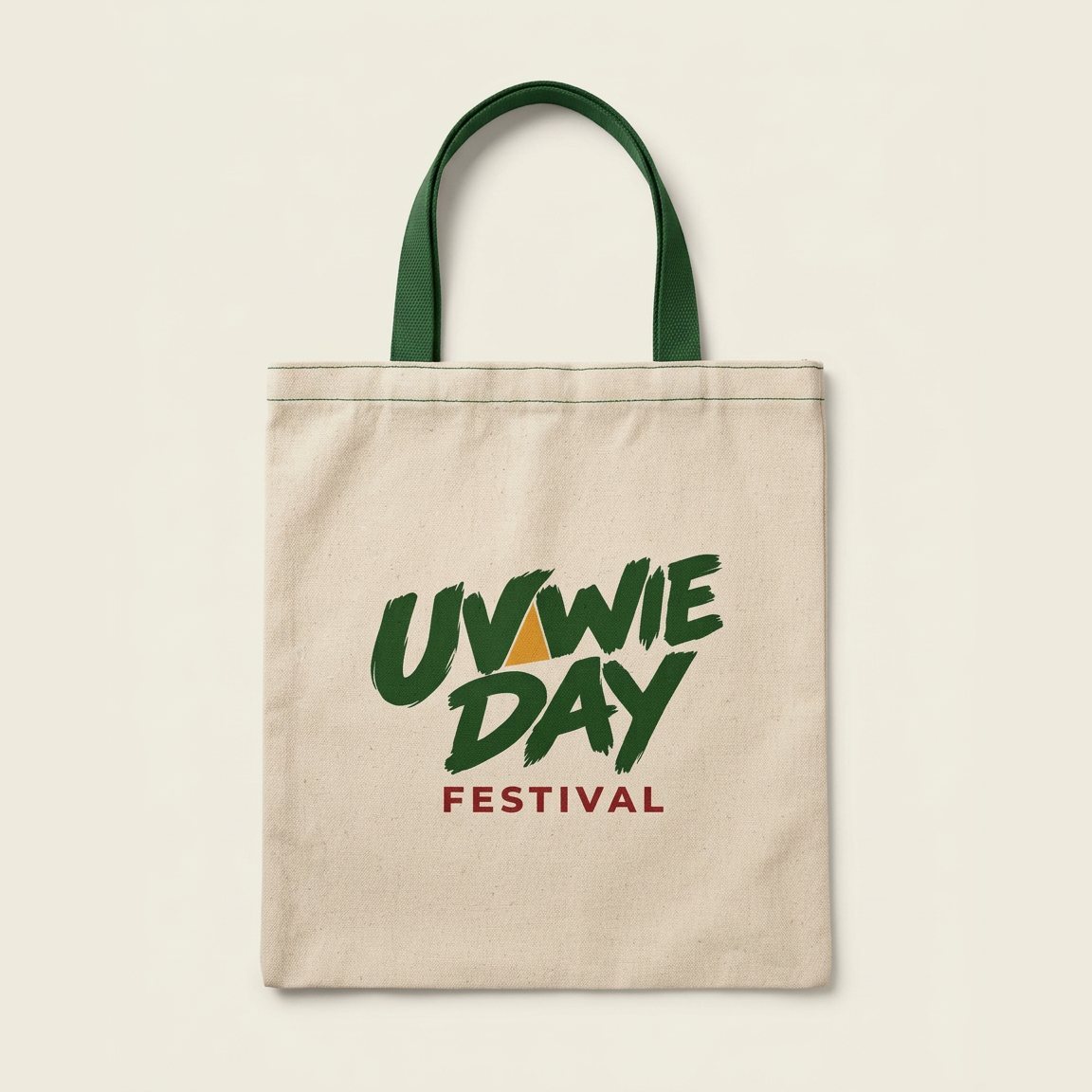Natural canvas tote bag with forest green straps and the full-colour logo.